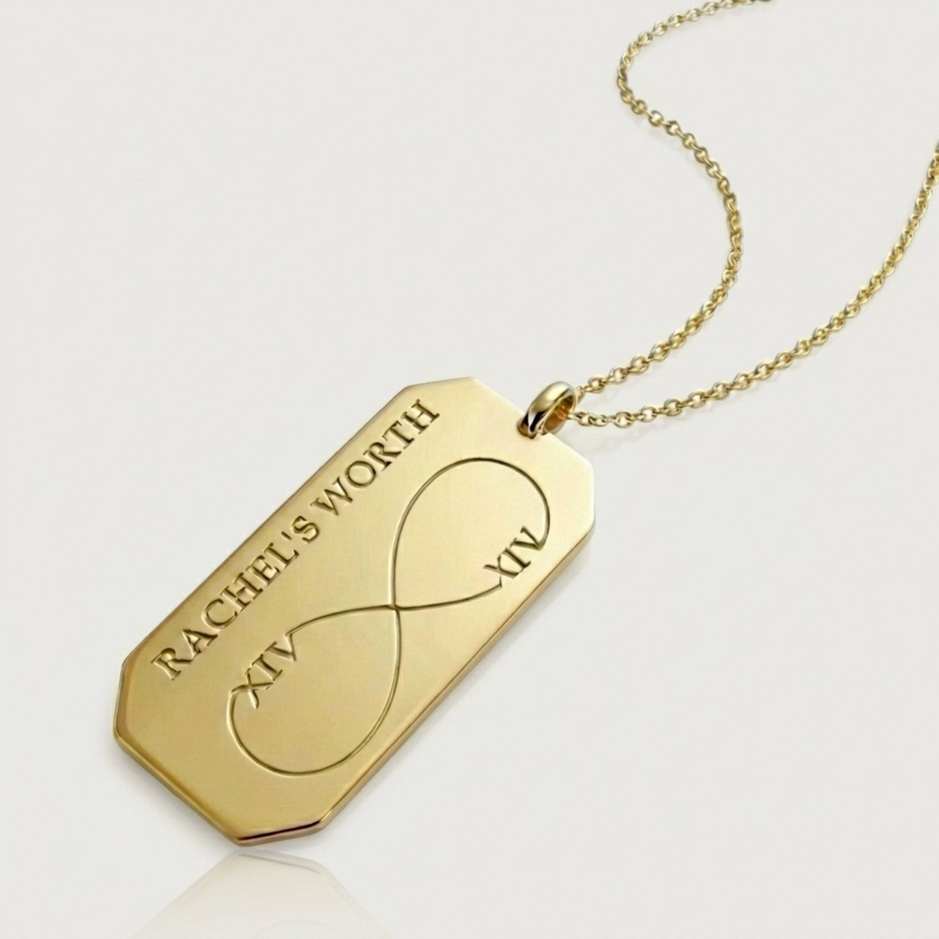 Gold pendant necklace with 'RACHEL'S WORTH' engraving on a light gray background