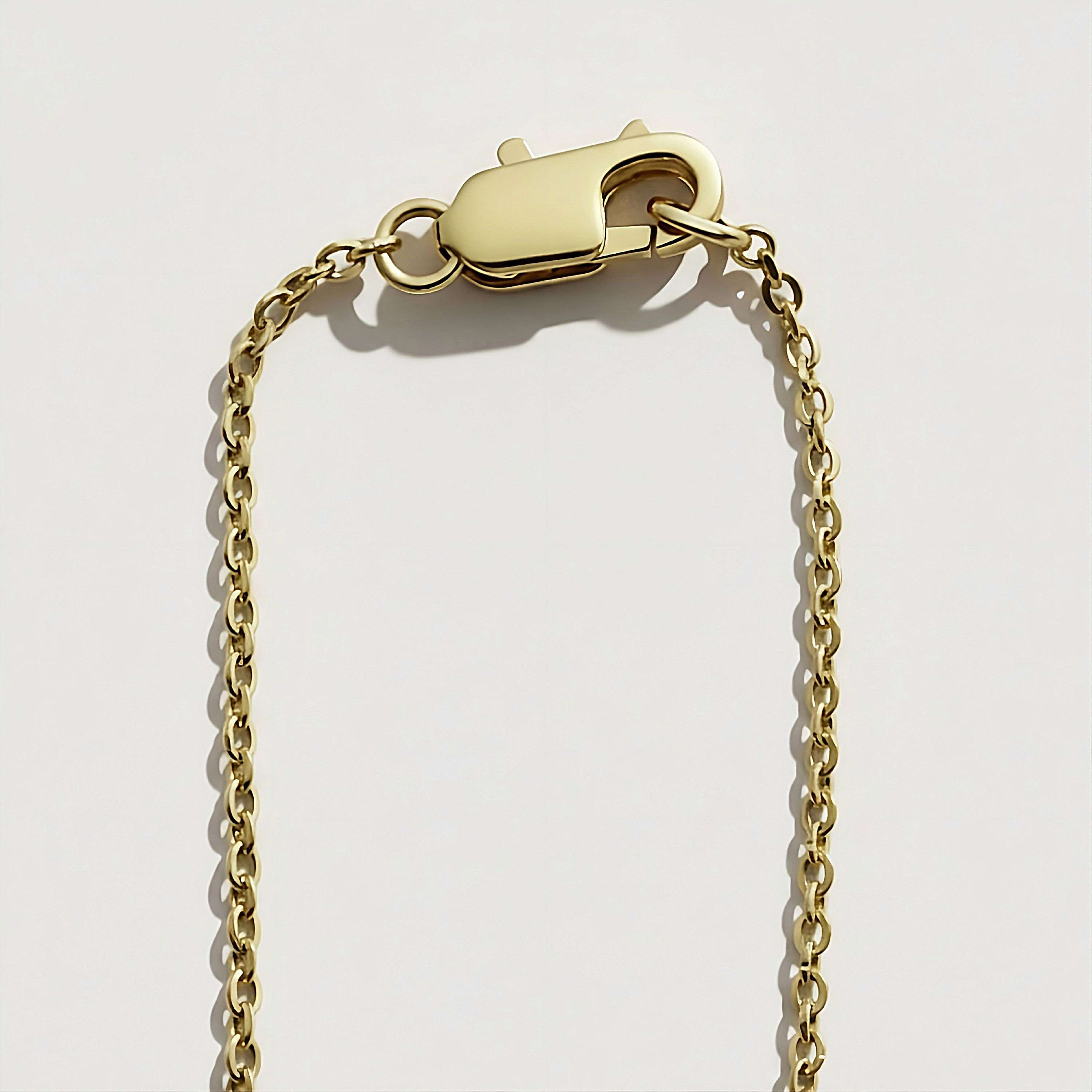 Close-up of the lobster clasp and chain on the Rachel's Worth 14k gold vermeil Confident Identity coin necklace, showcasing premium craftsmanship and secure fastening.