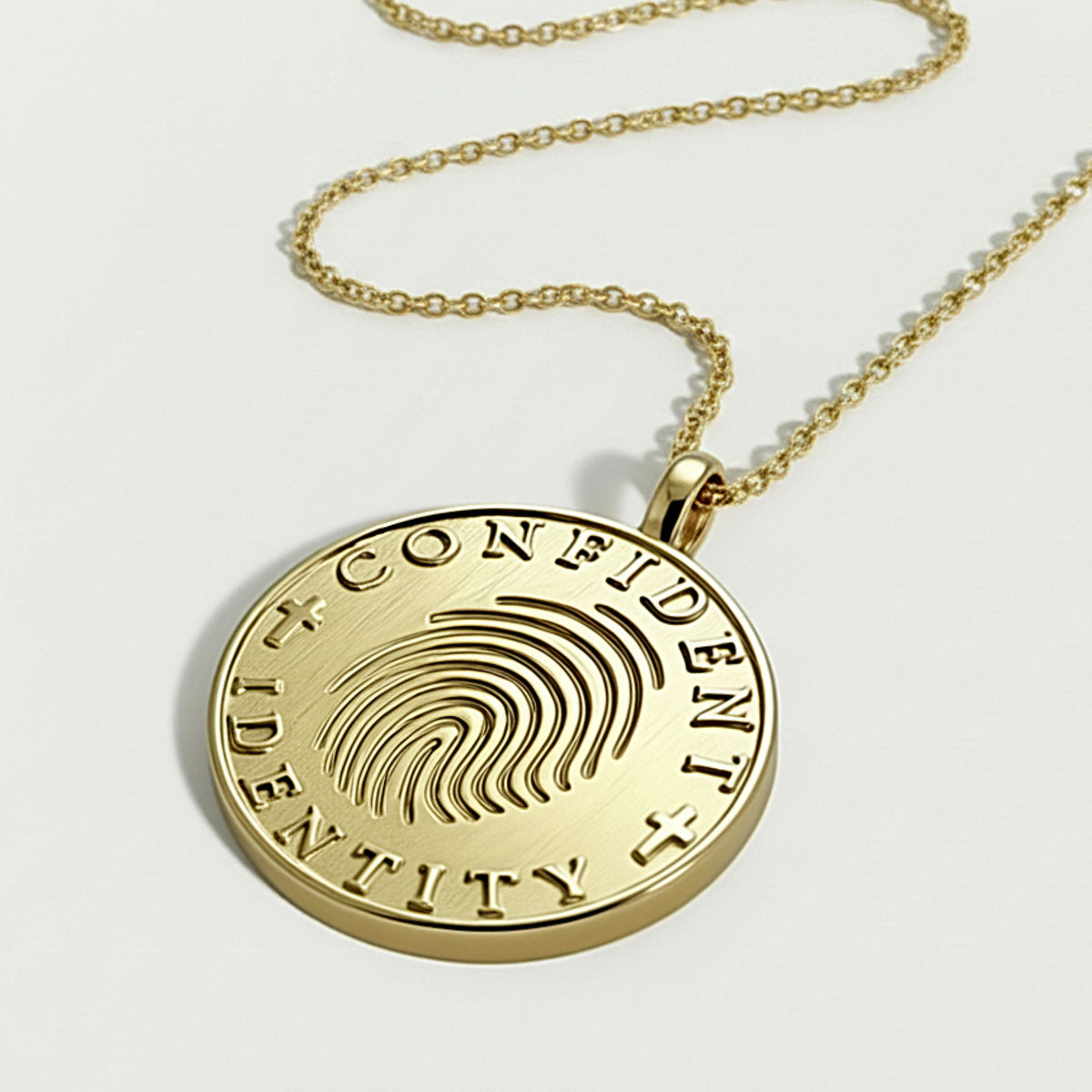 Close-up of the Rachel's Worth Confident Identity Yellow Gold Vermeil coin pendant highlighting its meaningful design.