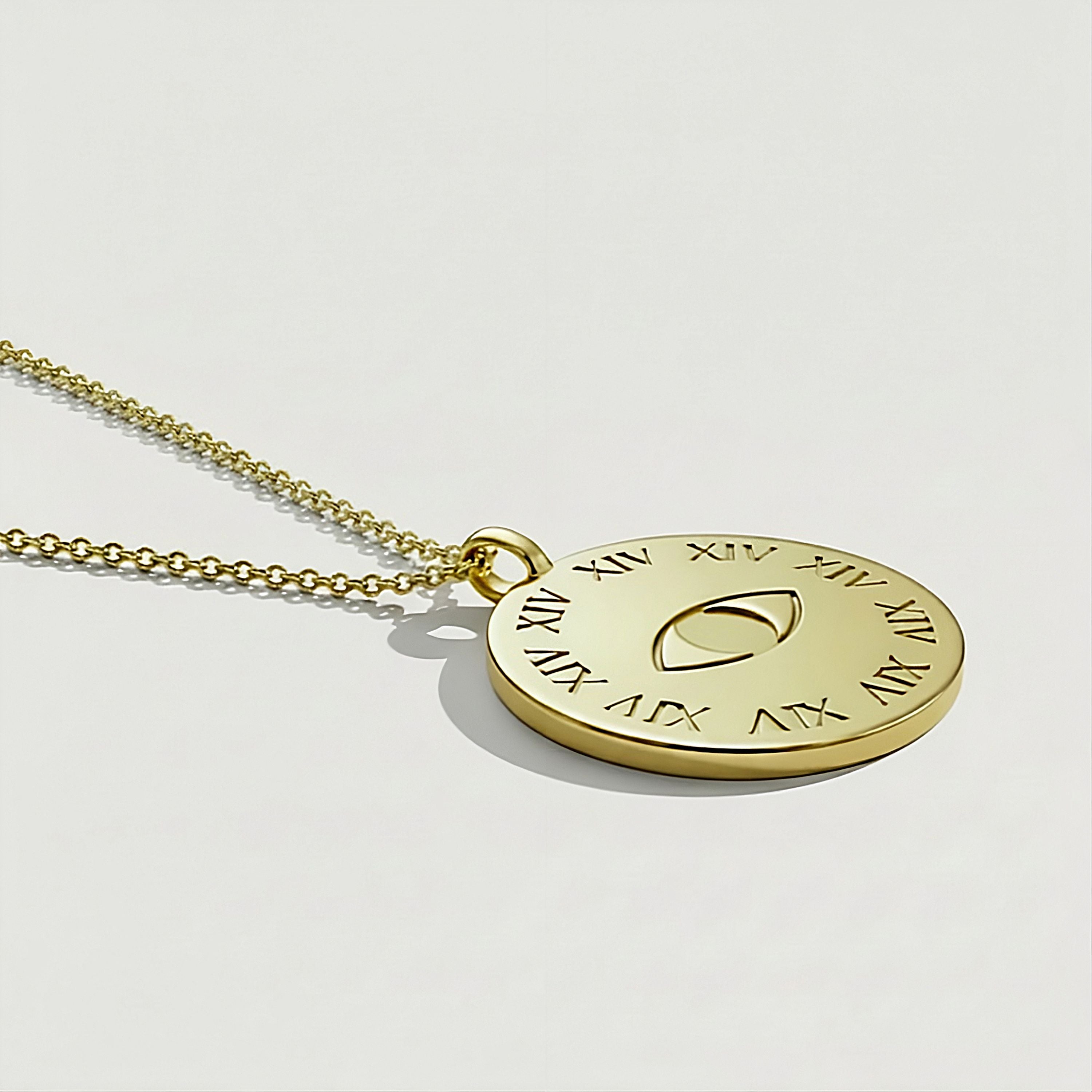 Close-up of the Rachel's Worth Legacy 14K Gold Coin Necklace featuring XIV and eye symbols representing Rachel, Leah, and Christ's lineage.