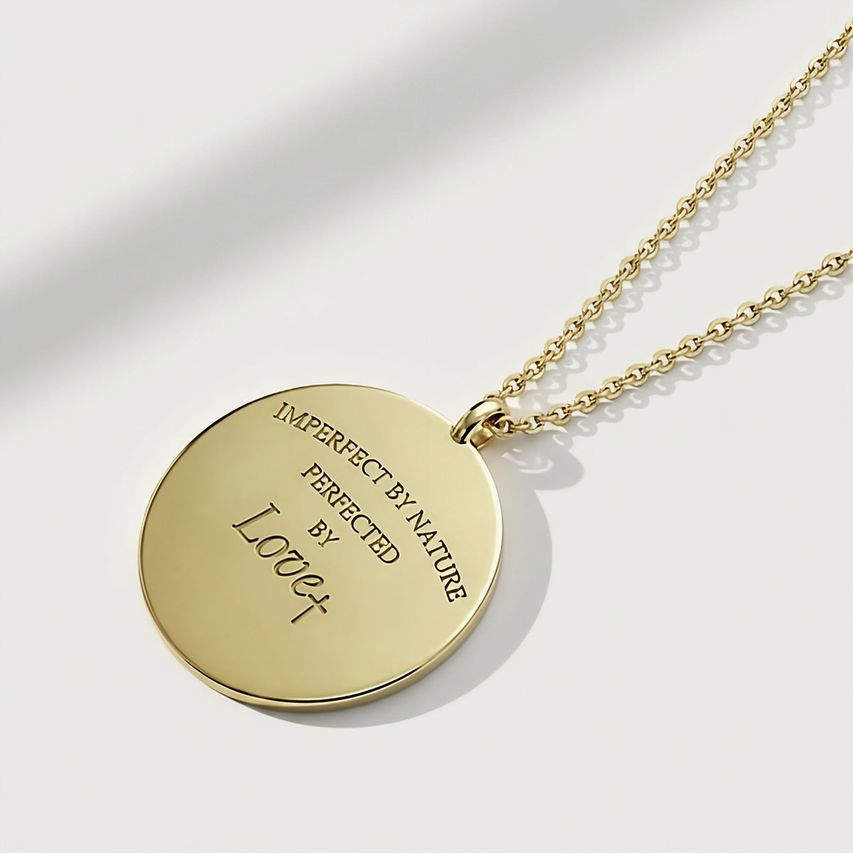 Detailed view of the solid 14K gold craftsmanship on the Rachel's Worth Perfected by Love Coin Pendant Necklace.