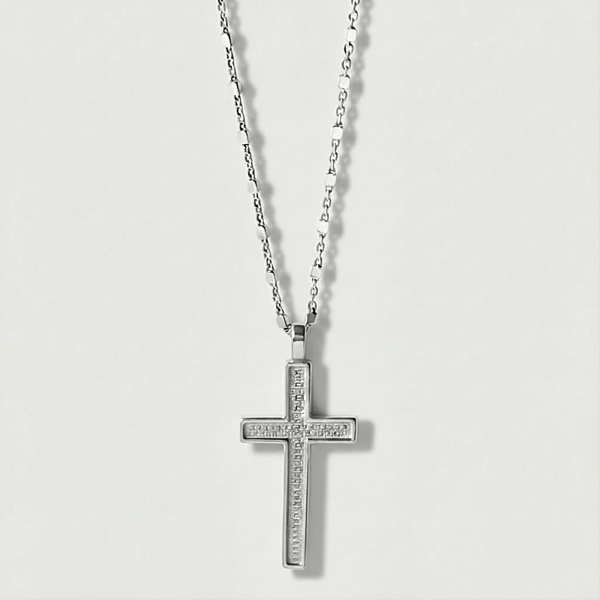 Front view of the Rachel's Worth Sterling Silver Cross Necklace with a polished minimalist cross pendant.