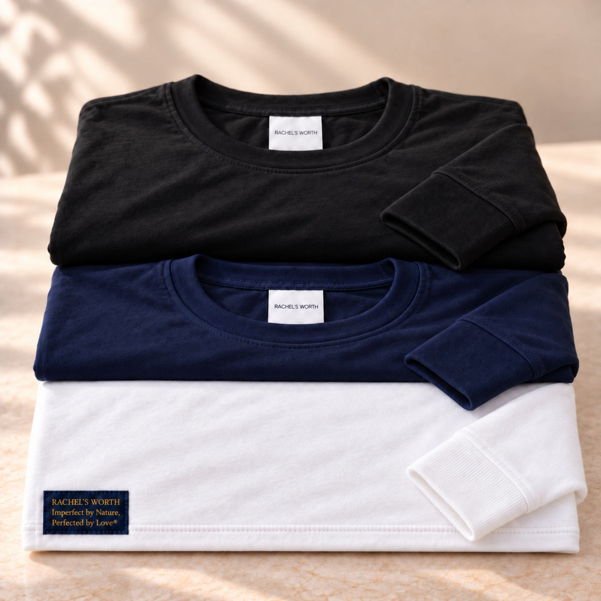 Available color options for the Rachel's Worth Demise Long Sleeve Tee.