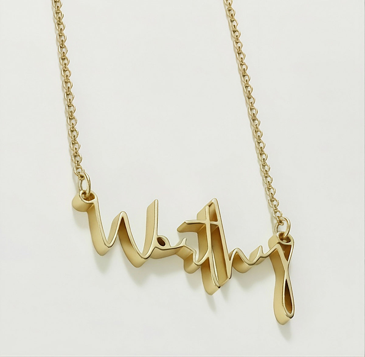 Detailed view of the 18K yellow gold vermeil craftsmanship on the Rachel's Worth Worthy Necklace.