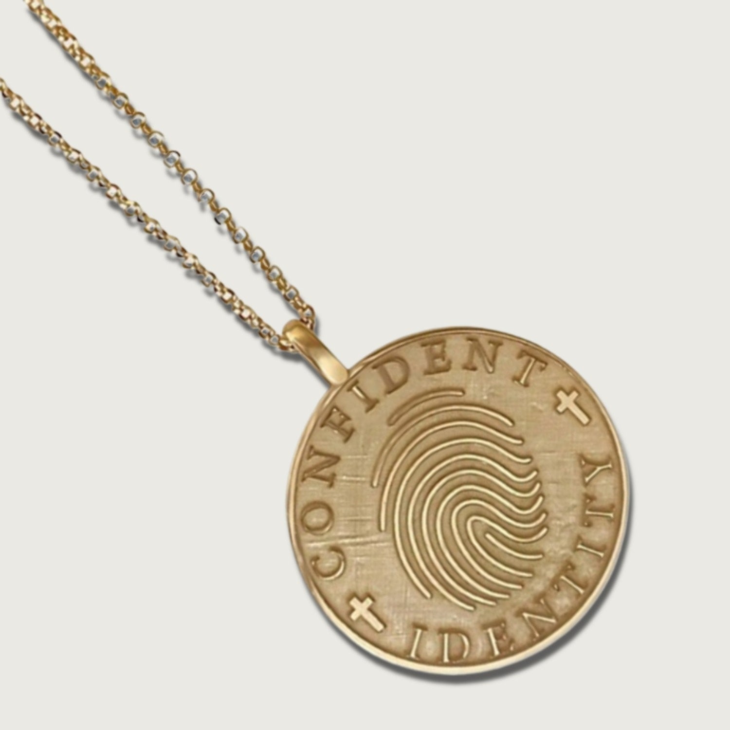 Close-up of gold coin pendant showcasing engraved details – Rachel’s Worth® Jewelry