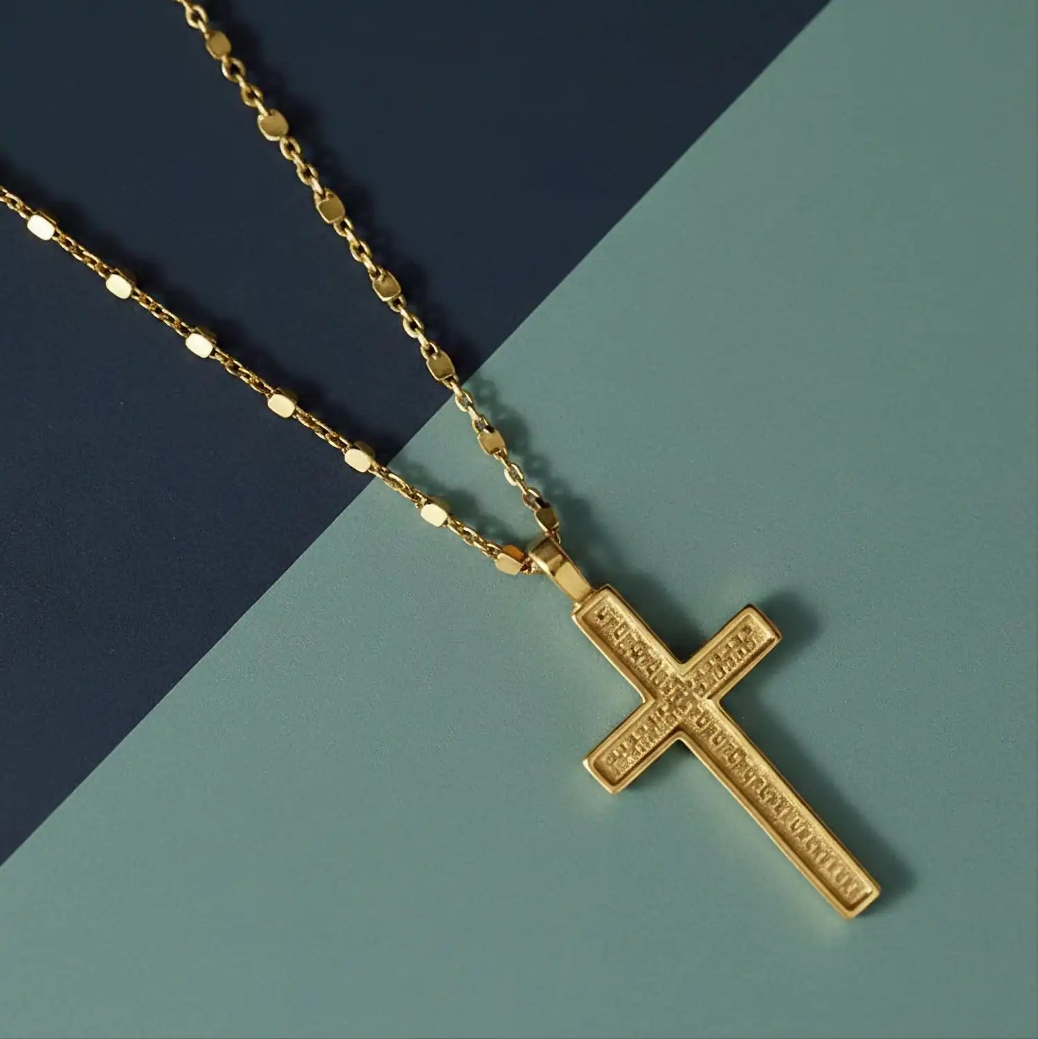 18k gold cross necklace from Rachel's Worth displayed on a blue background, featuring an elegant faith-inspired Christian jewelry design for women.