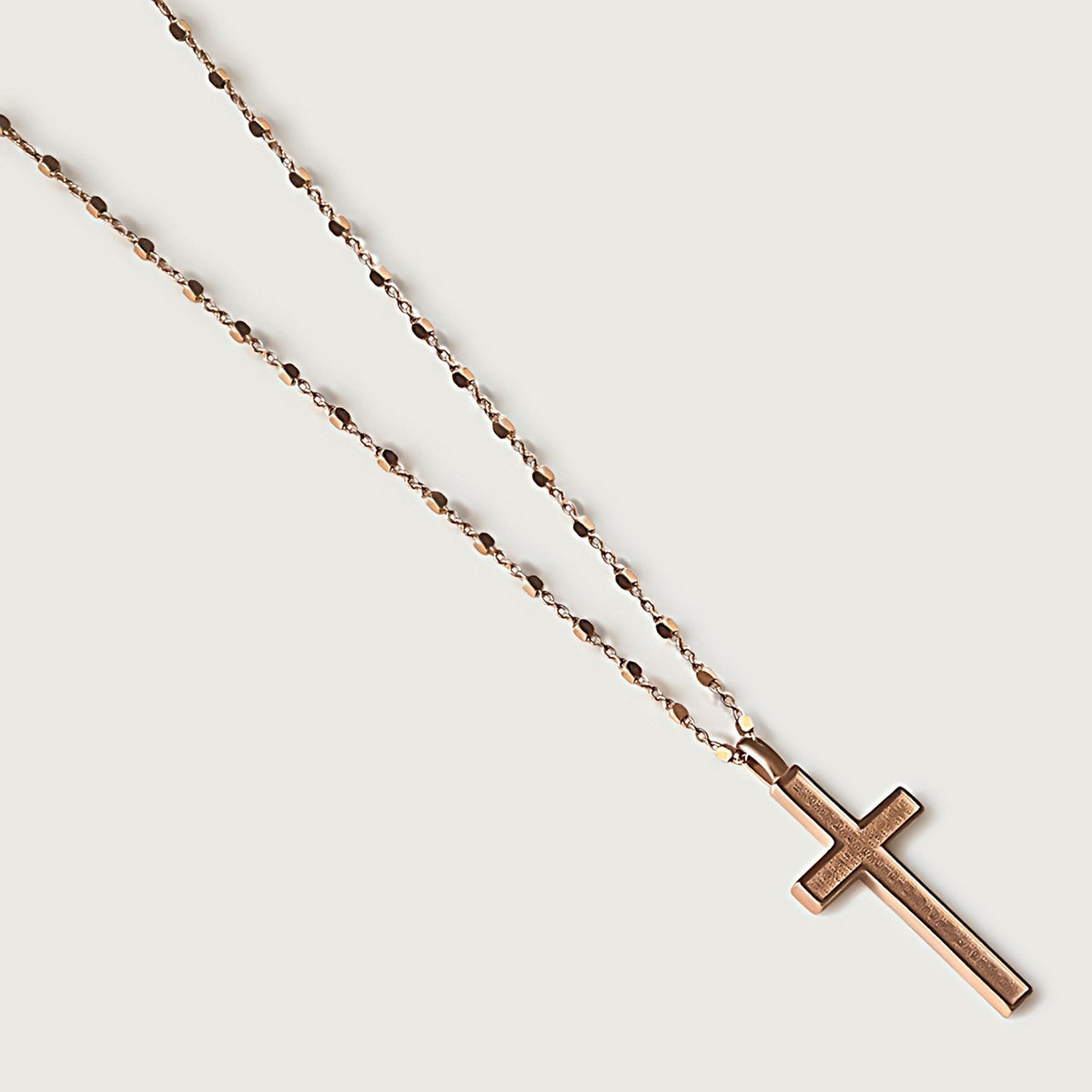 Close-up of the 18K Rose Gold Vermeil Cross Pendant highlighting its warm polished finish.