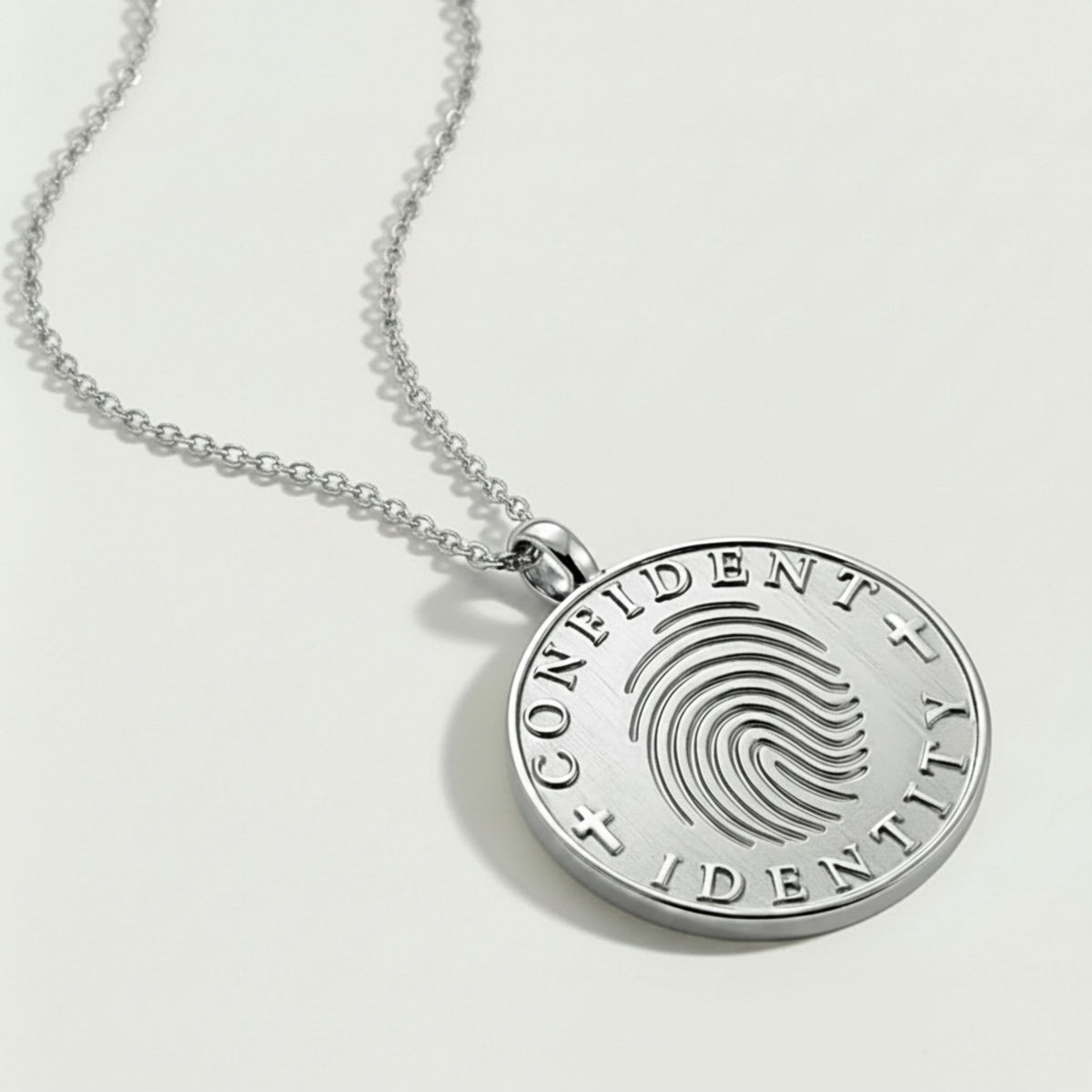 Front view of the Confident Identity Sterling Silver Coin Pendant Necklace with a refined polished finish.