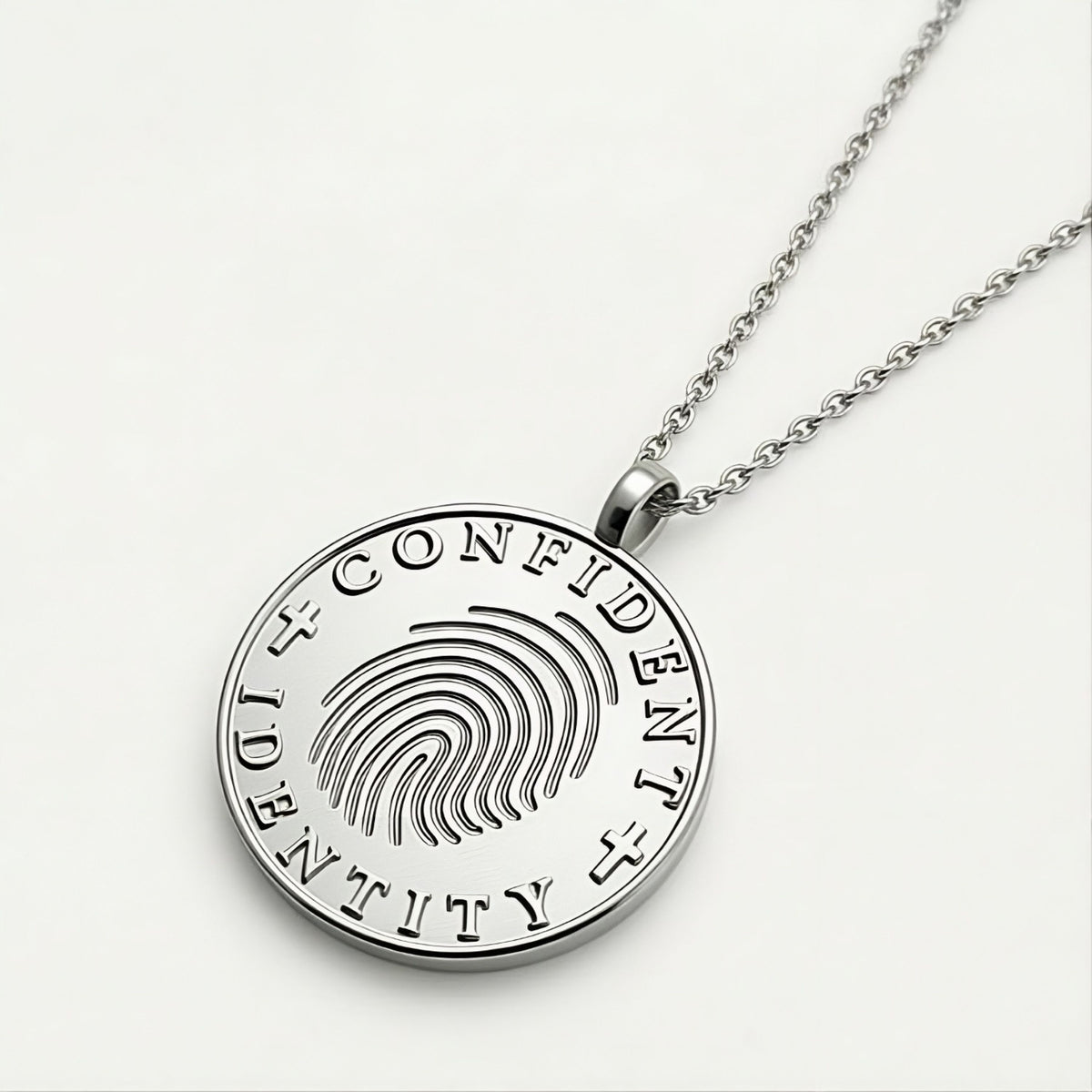 Detailed view of the .925 sterling silver craftsmanship on the Confident Identity Coin Pendant Necklace.