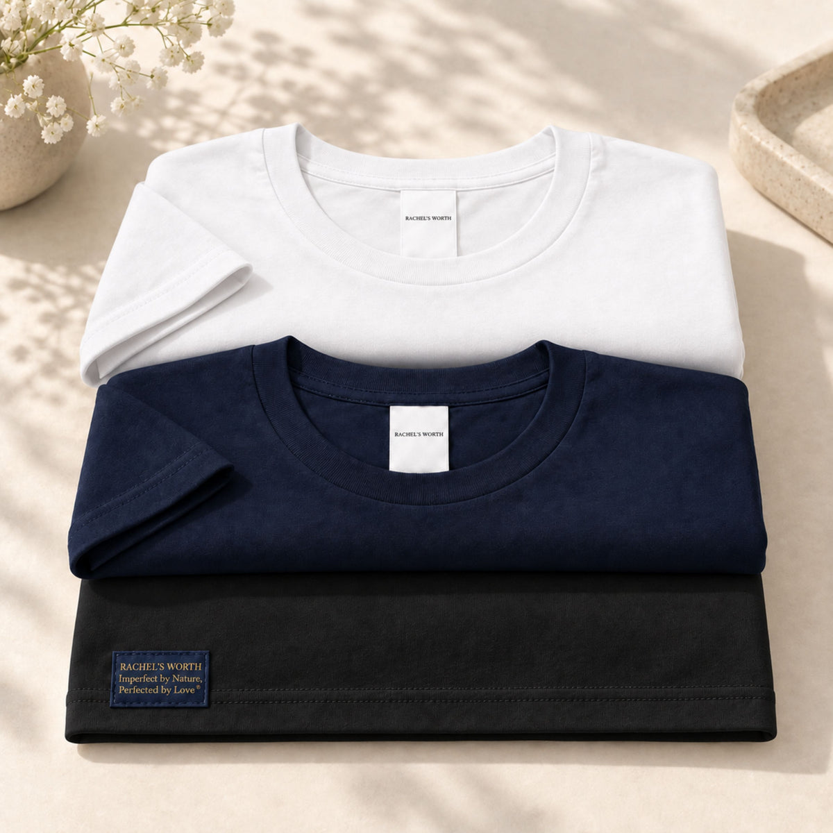 Black, white, and navy color options for the Rachel's Worth Imperfect by Nature, Perfected by Love Women's Short Sleeve T-Shirt.
