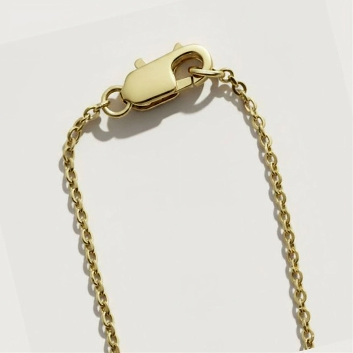 Chain and clasp detail of the Rachel's Worth Infinity Yellow Gold Vermeil Pendant Necklace.