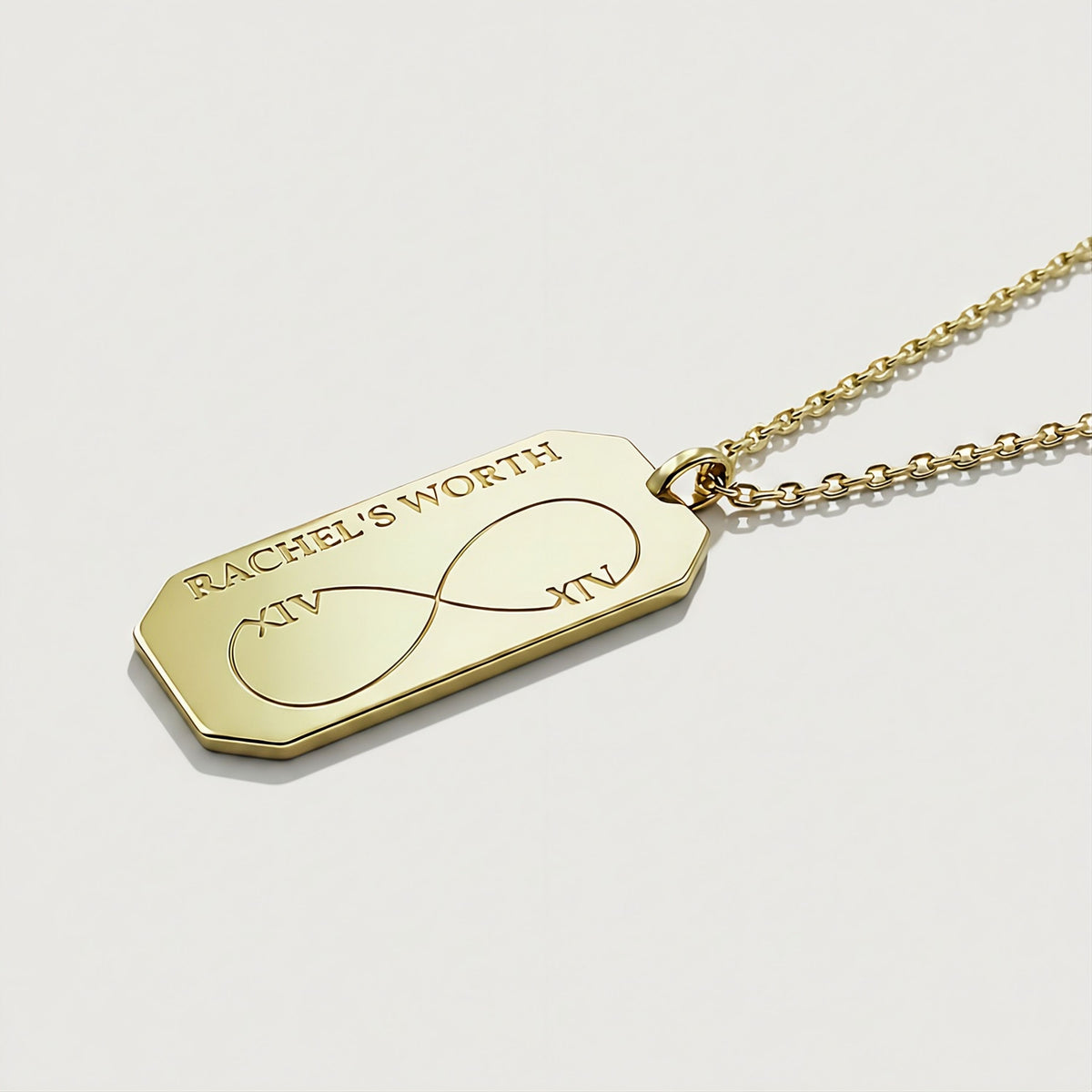 Close-up of the polished infinity pendant on the Rachel's Worth Yellow Gold Vermeil Necklace.