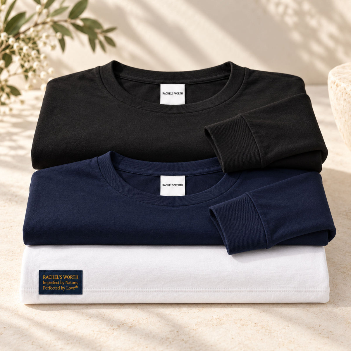 White, navy, and black color options for the Rachel's Worth Perfected by Love Wave Women's Long Sleeve T-Shirt.