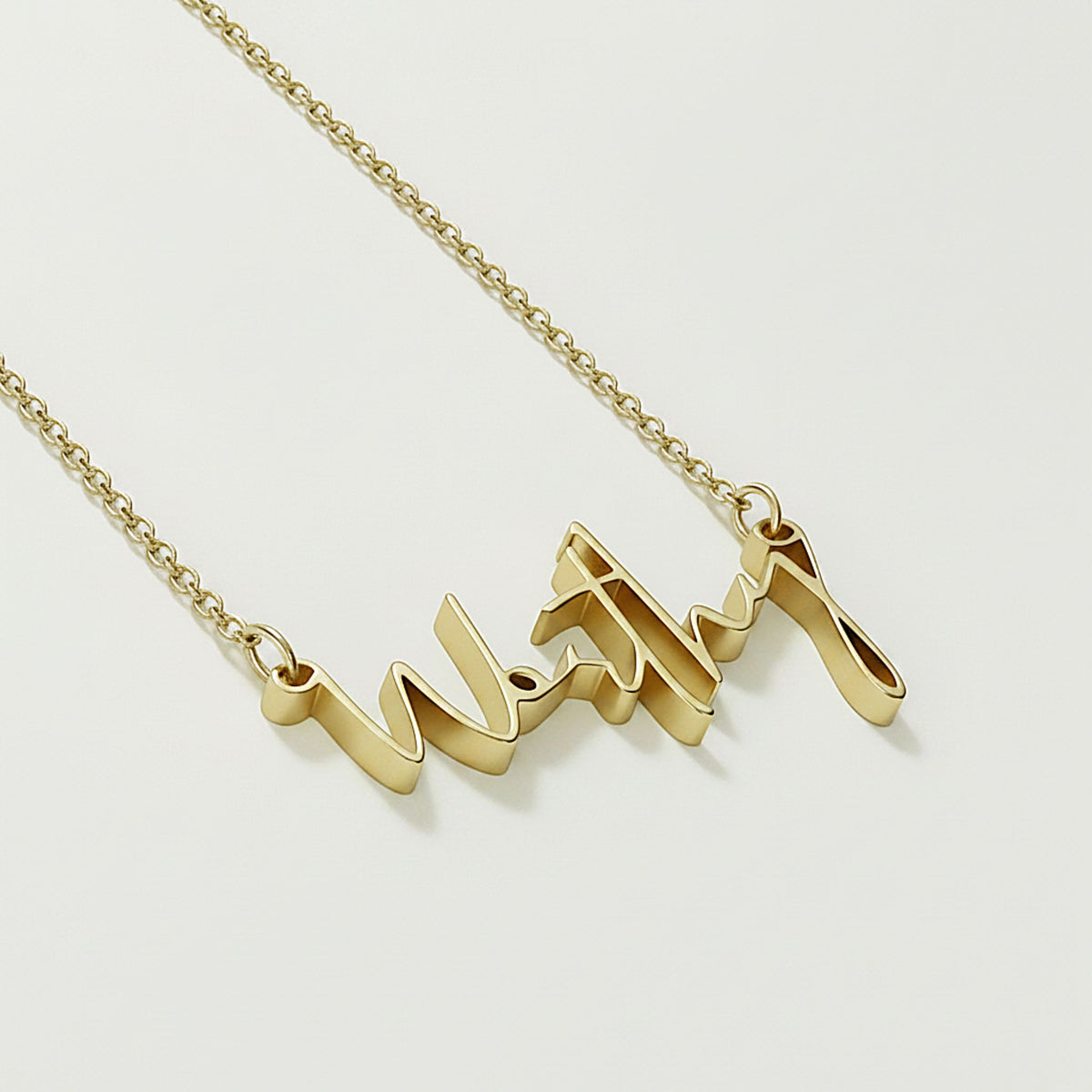 Close-up of the Worthy affirmation pendant highlighting its polished 18K yellow gold vermeil finish.