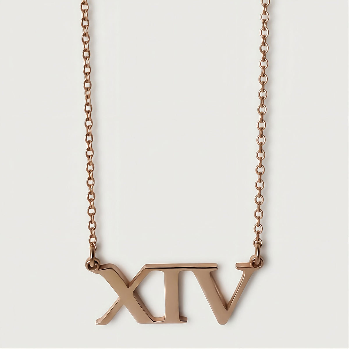Front view of the XIV 18K Rose Gold Vermeil Pendant Necklace featuring its streamlined Roman numeral design.