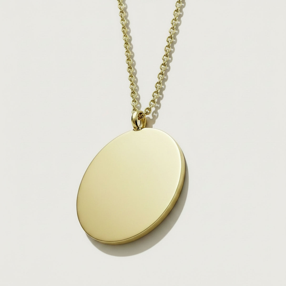 Back view of the XIV Solid 14K Gold Coin Pendant Necklace showing its polished construction.