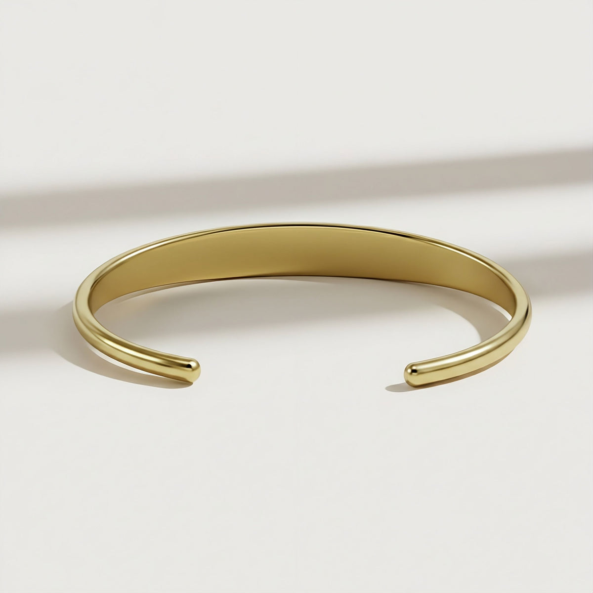 Interior view of the XIV Solid 14K Gold Cuff Bracelet showing its polished construction and 1.15-inch opening.