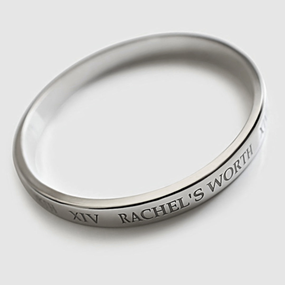 Side profile of the XIV Sterling Silver Bangle Bracelet showing its slim 0.31-inch width.
