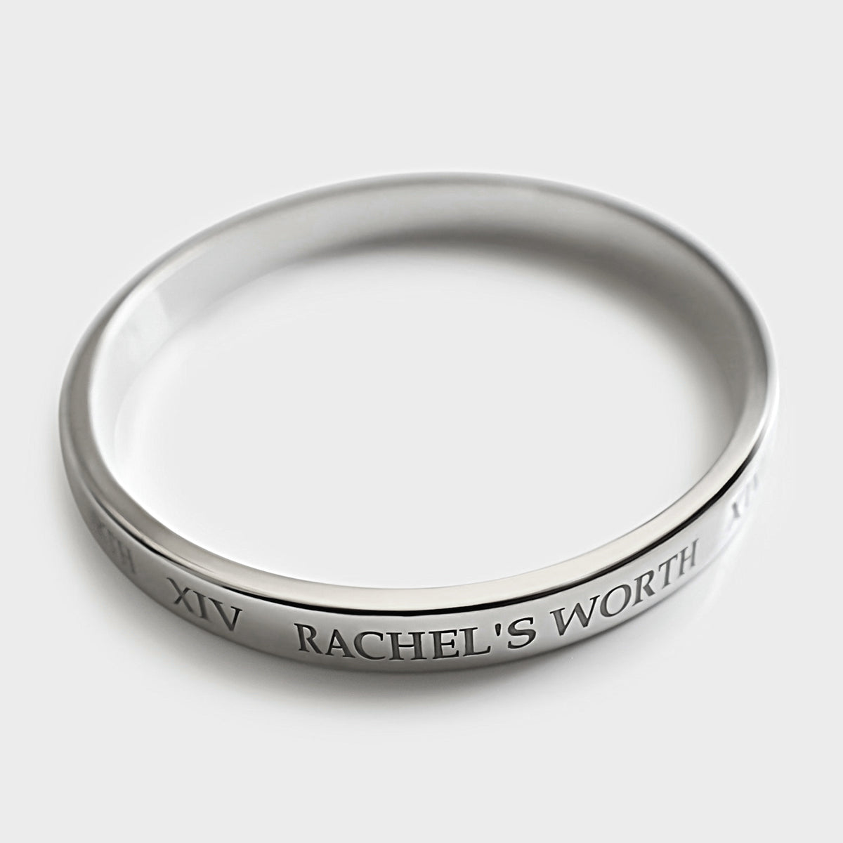 Close-up of the XIV symbolism on the Rachel's Worth Sterling Silver Bangle Bracelet.