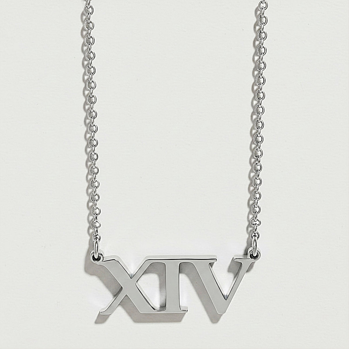 Front view of the XIV Sterling Silver Pendant Necklace featuring its streamlined Roman numeral design.