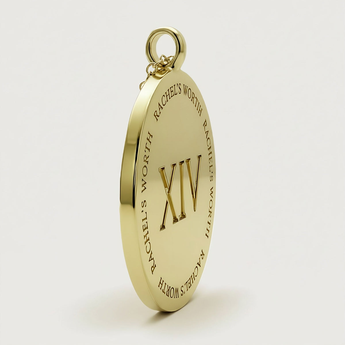 Close-up of the XIV coin pendant on the Rachel's Worth Yellow Gold Vermeil Necklace with polished detailing.